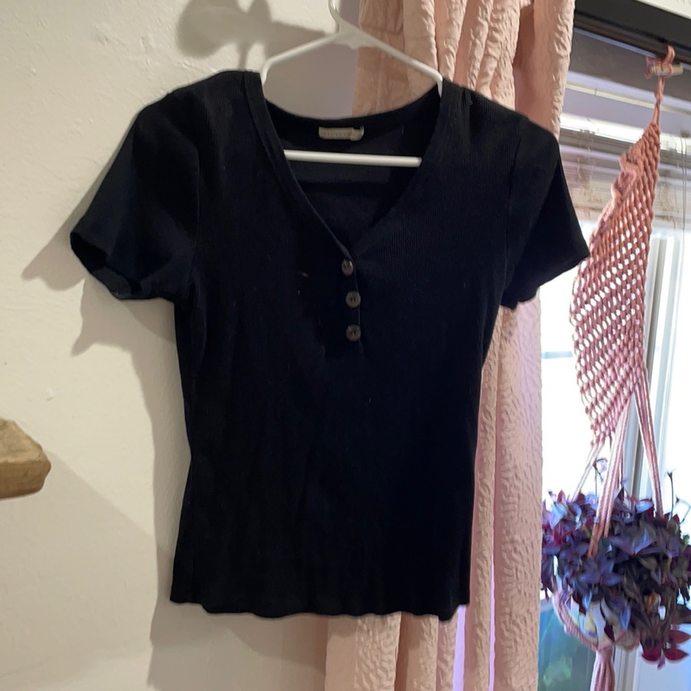 Black plain button up top.